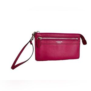 COACH - Hot Pink Leather Wristlet. Zip closure.
Size: 7.5" x 4.5"